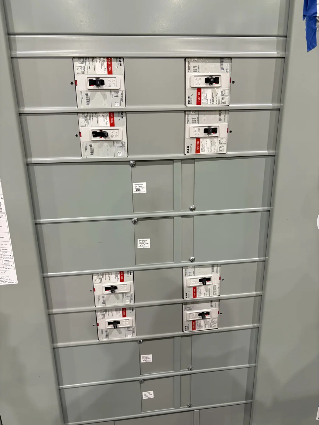 Owner-supplied Eaton panelboard containing multiple FDC-labeled circuit breakers